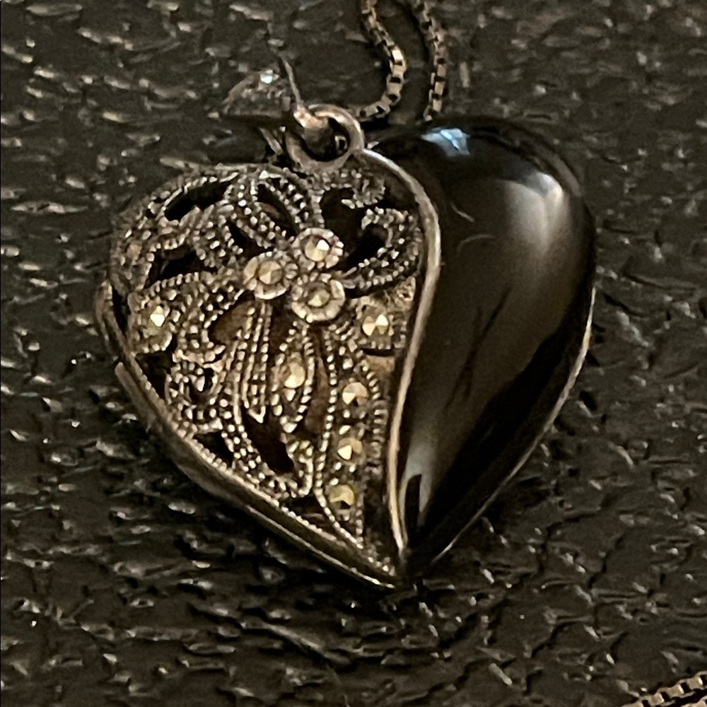 Vintage sterling silver and Onyx heart locket with a 25 inch chain